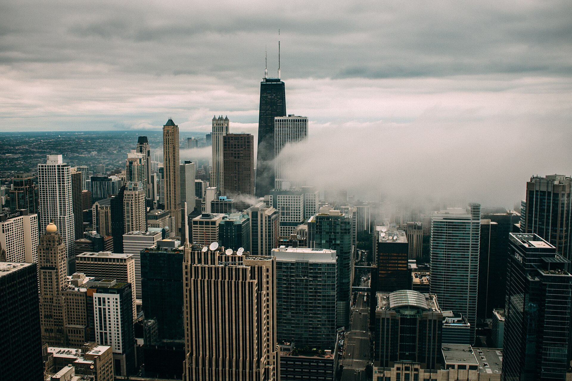 Downtown Chicago skyscrapers rising toward low clouds